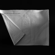 Ceramic envelope with the words "keep quiet about the secret we share" artwork by Julie Derbyshire, Possession 1