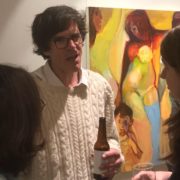 photo of Simon Klein at the Opening of his show with a beer in his hand