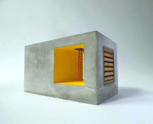 double concrete cube with glowing yellow interior and red ladder