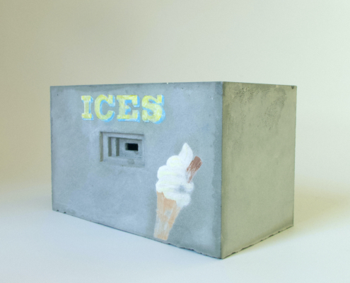 concrete block with ices text and an icecream cone painted on the side