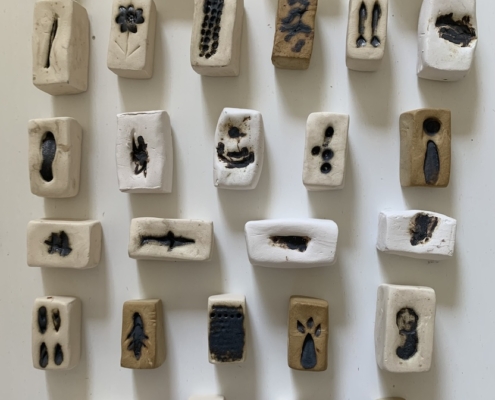 Violet Mareck, Memory stones. Clay and oxides. 30 x 30 cm